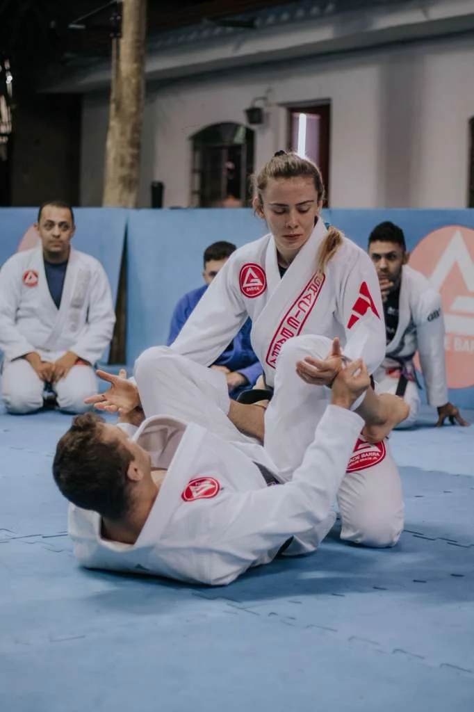 Advanced students training live Jiu-Jitsu on the mat